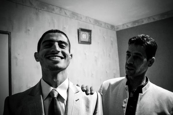 The young groom is smiling after being shaved by his uncle before "El Khouara" engagement celebration. Traditionally, the man goes visiting the girl's parents to ask her in marriage. It's the moment of "Khotba". Once families find an agreement about dowry, the boy and girl get officially engaged